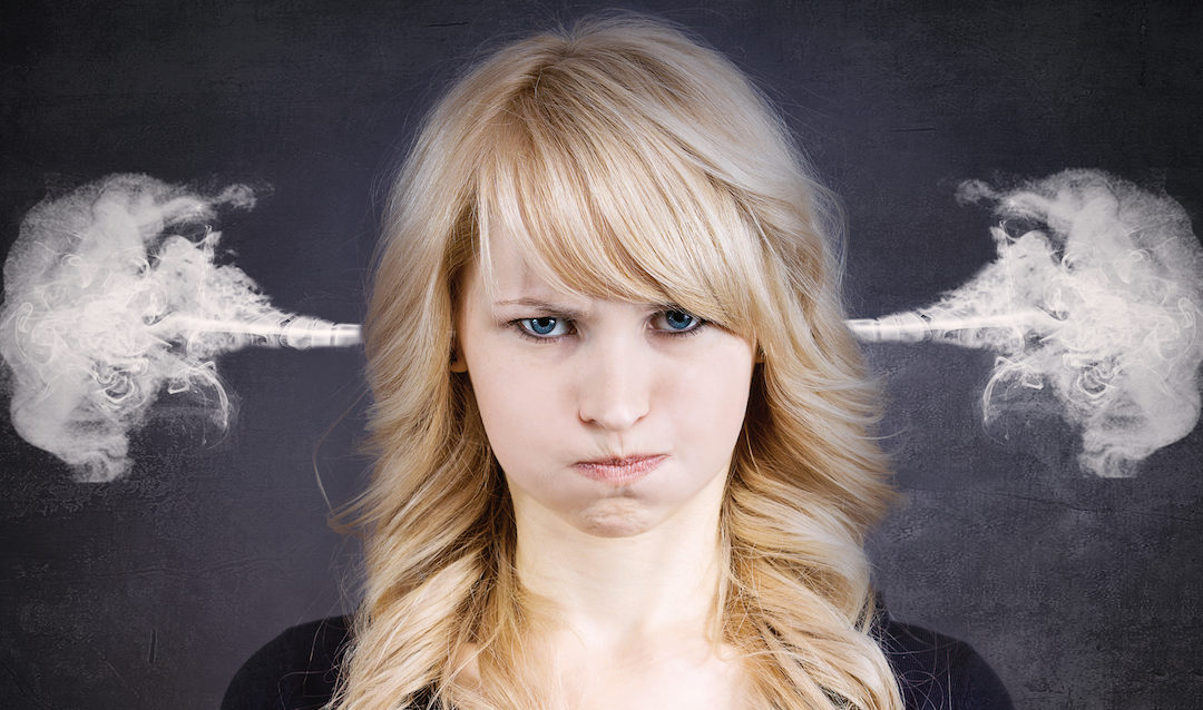 Frustrated woman with steam coming out of her ears